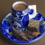 Chocolate Elixir in Cup with a truffle on a saucer